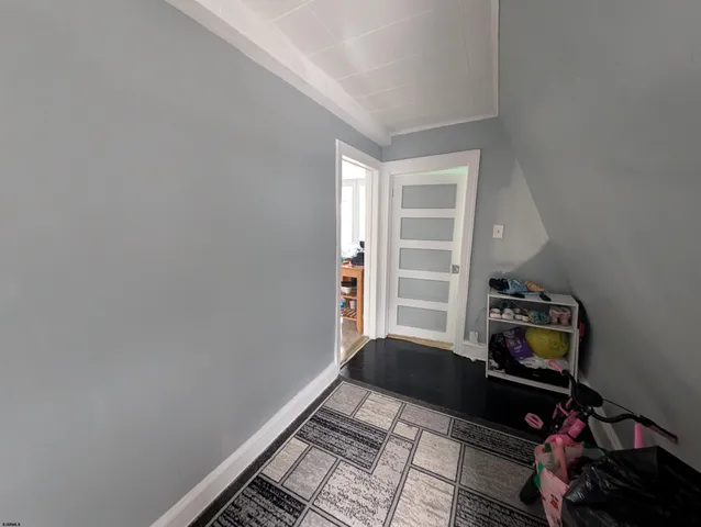 a living room with furniture and natural light