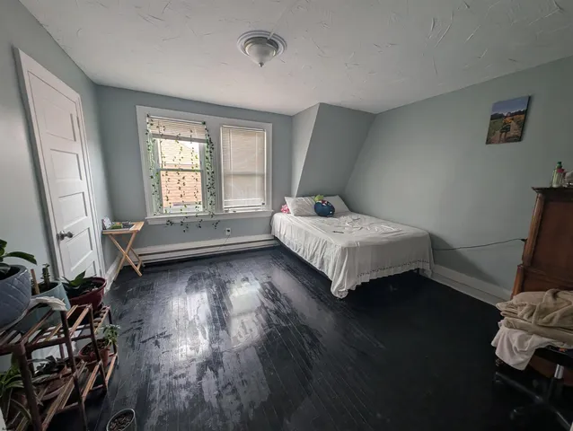 a room with a bed and a window