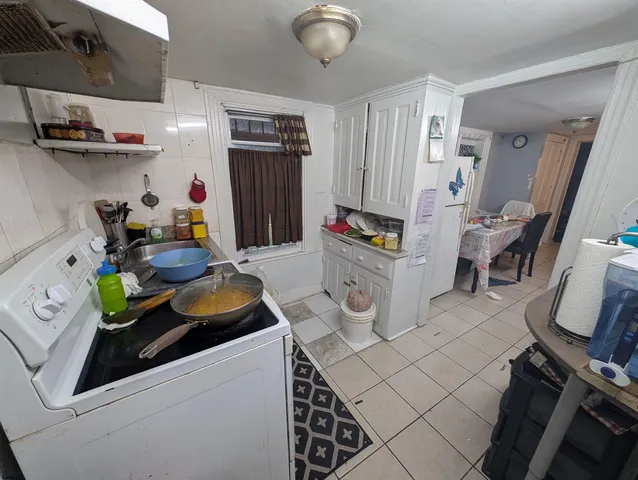 a room with furniture a rug and gym equipment