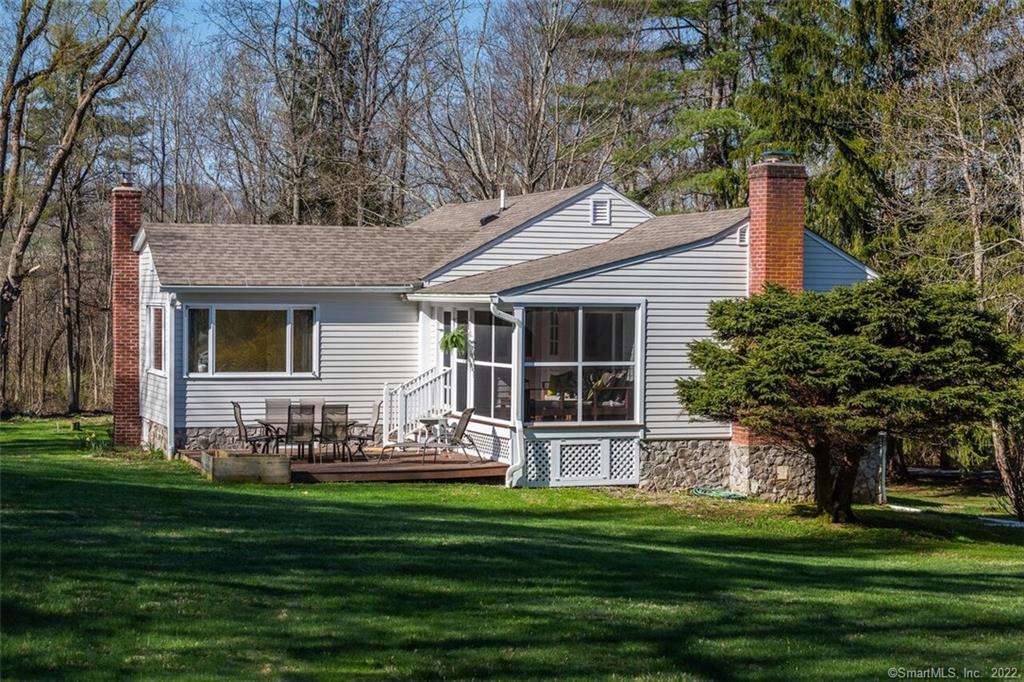 97 Amenia Road Sharon, CT 06069 - Photo 1 of 1 a front view of a house with a garden