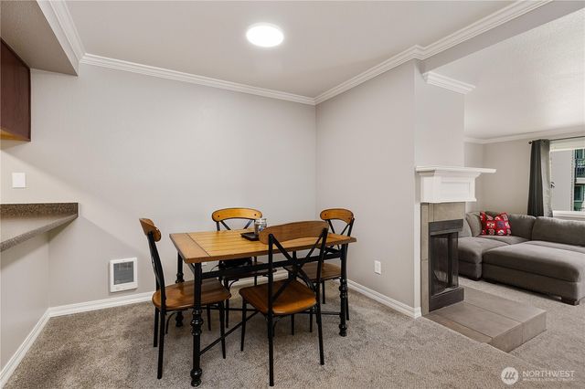 a view of a dining room with furniture and window