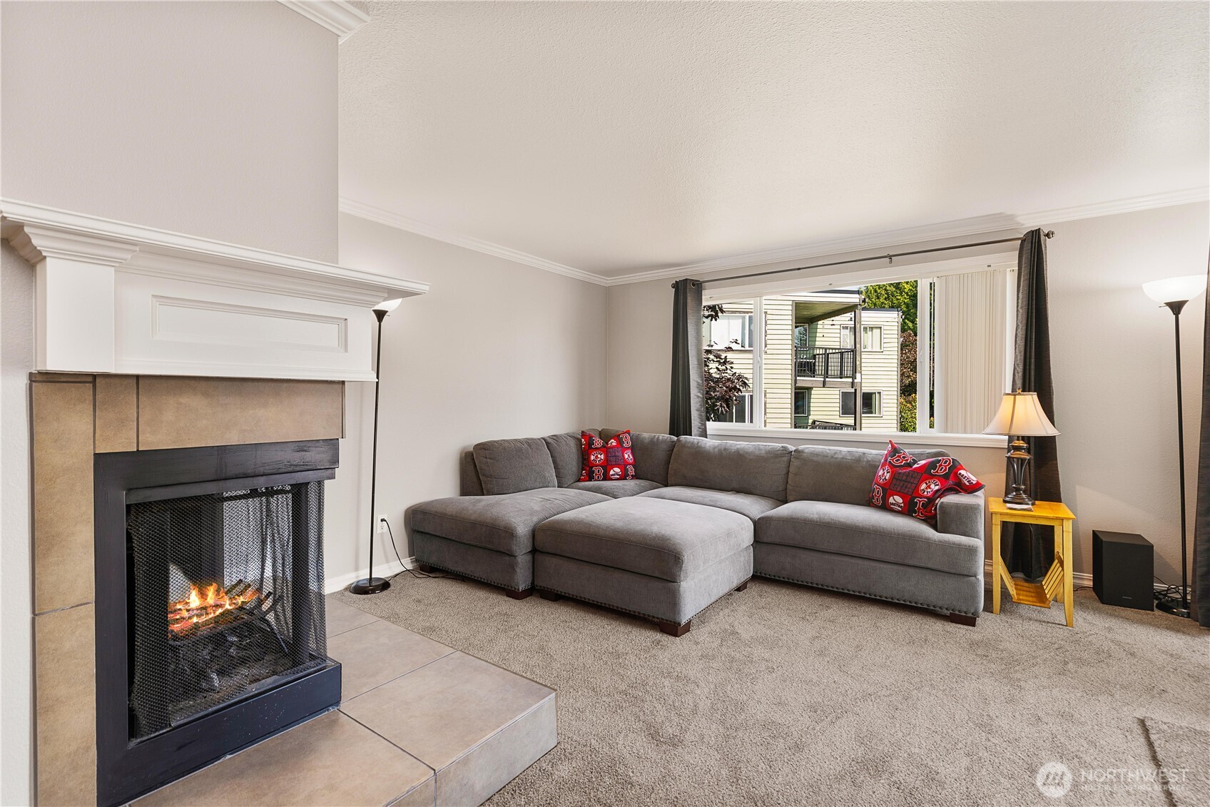 13007 East Gibson Road, Unit U238 Everett, WA 98204 - Photo 18 of 29 a living room with furniture a window and a fireplace