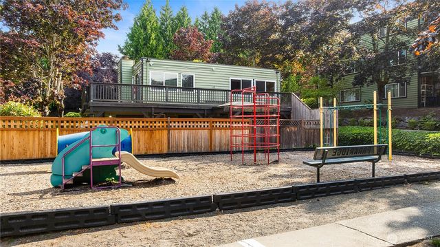 a view of a house with backyard wooden floor and a tub