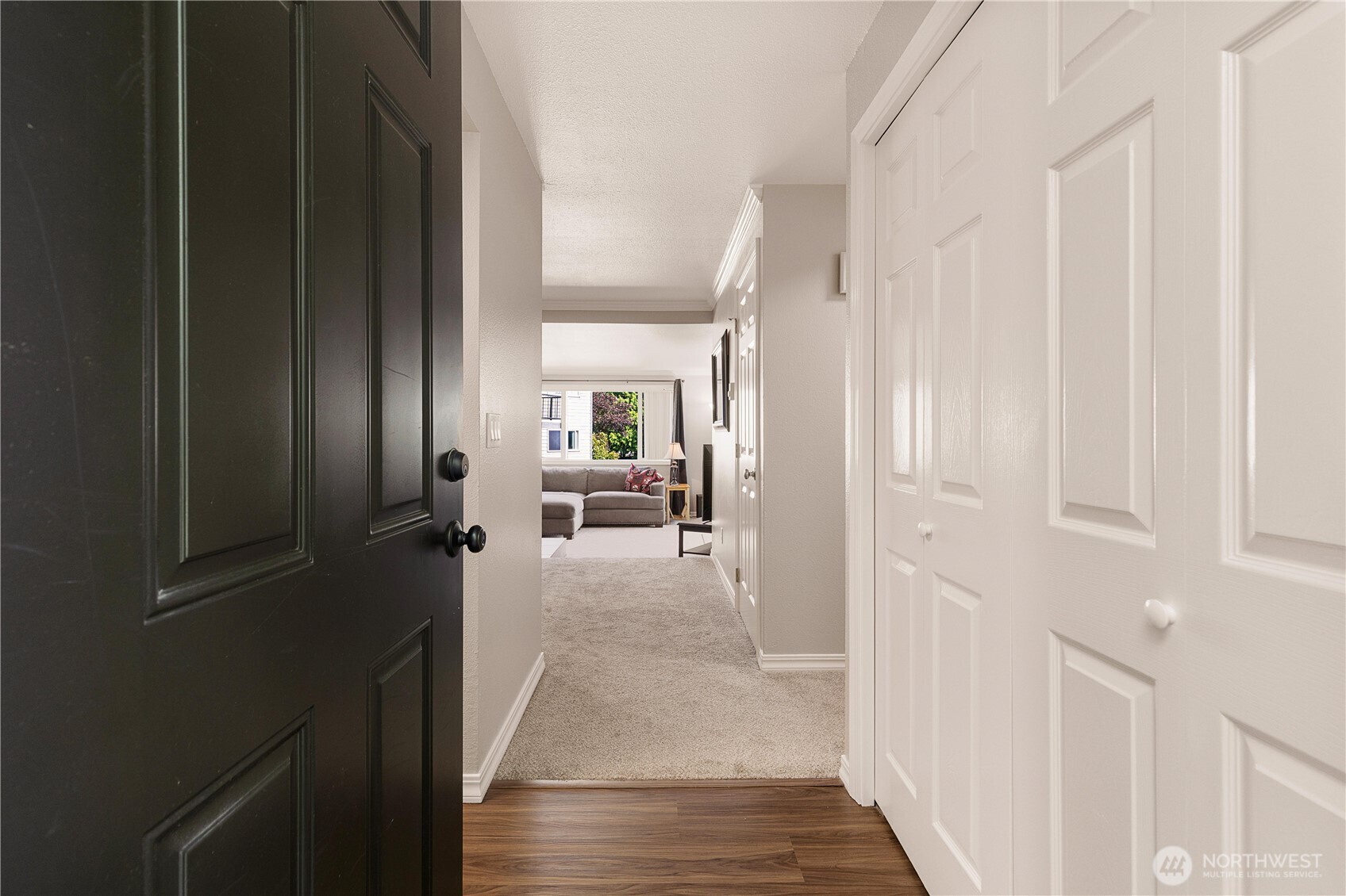 13007 East Gibson Road, Unit U238 Everett, WA 98204 - Photo 7 of 29 a view of a hallway with a livingroom and furniture