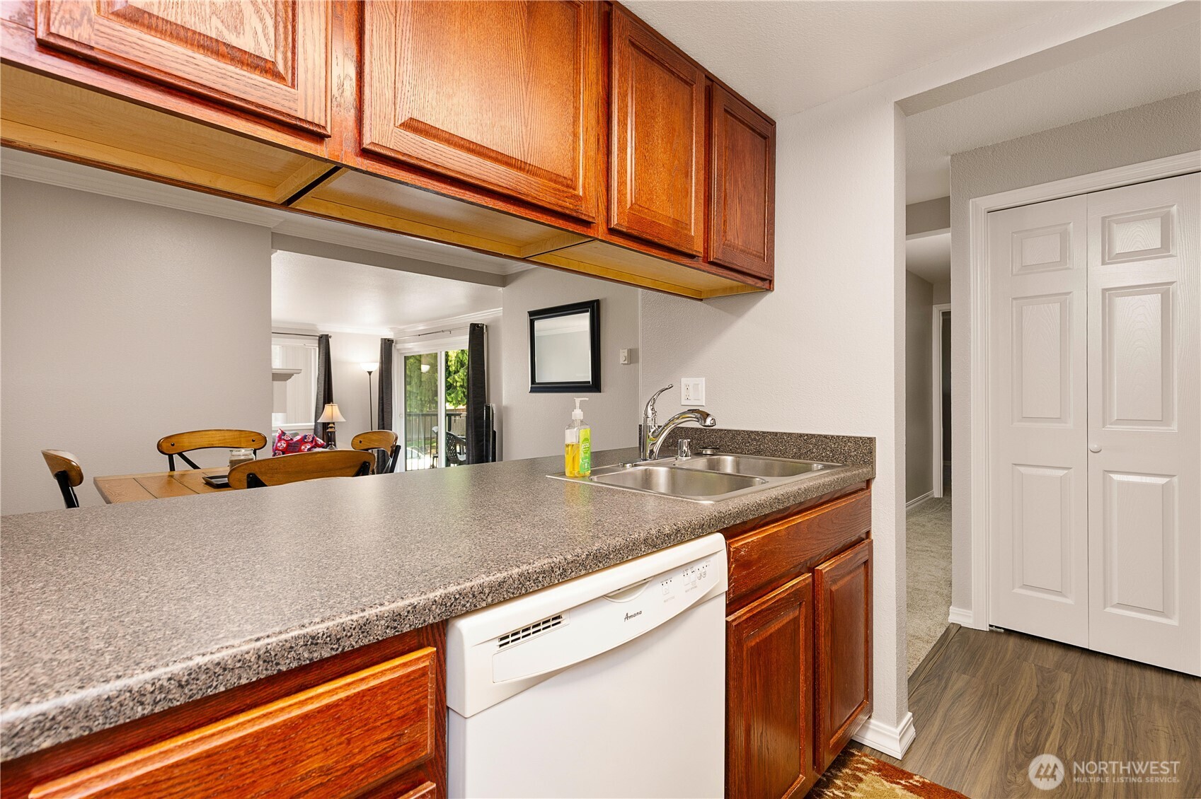 13007 East Gibson Road, Unit U238 Everett, WA 98204 - Photo 10 of 29 a kitchen with stainless steel appliances granite countertop a sink a stove and cabinets