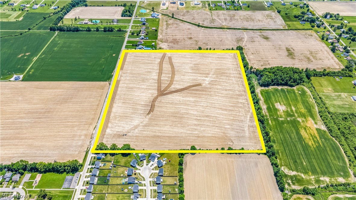 Fowl Road Elyria, OH 44035 - Photo 4 of 10 Aerial view of a large, level land parcel highlighted with a yellow border