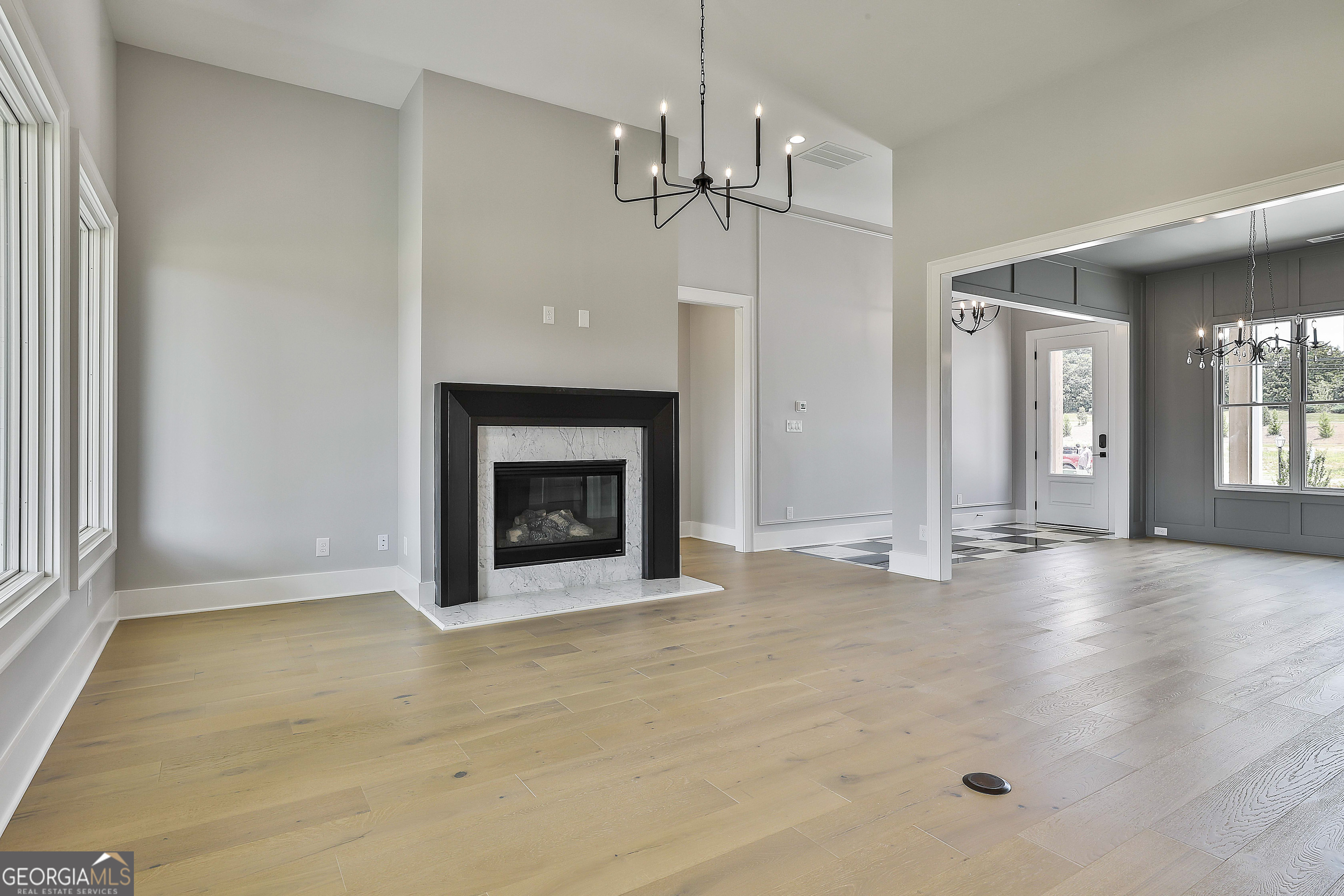 319 Ruffian Circle, Unit 71 Peachtree City, GA 30269 - Photo 15 of 43 a view of an empty room with a fireplace and a window