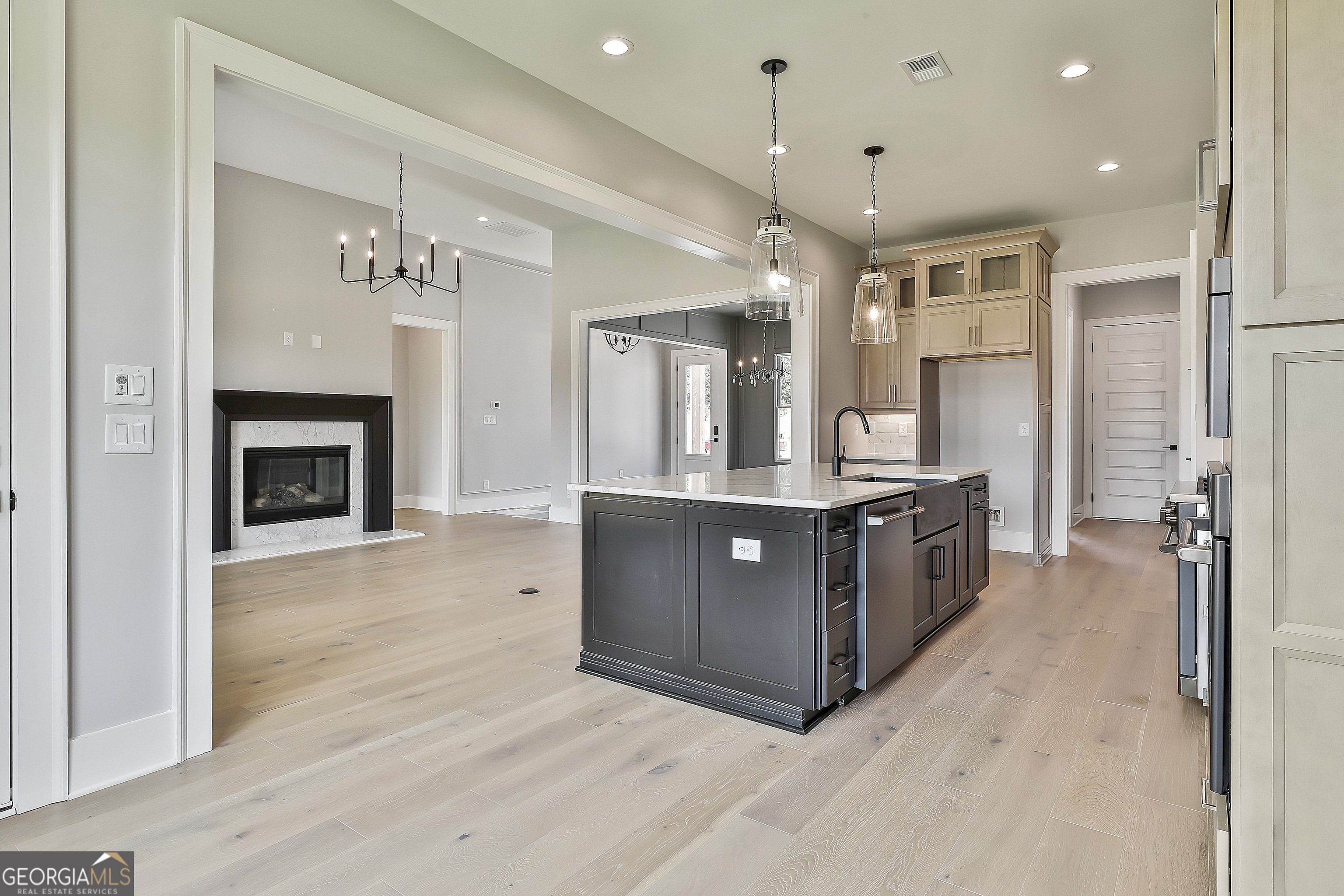 319 Ruffian Circle, Unit 71 Peachtree City, GA 30269 - Photo 17 of 43 a large kitchen with a large counter top cabinets and stainless steel appliances