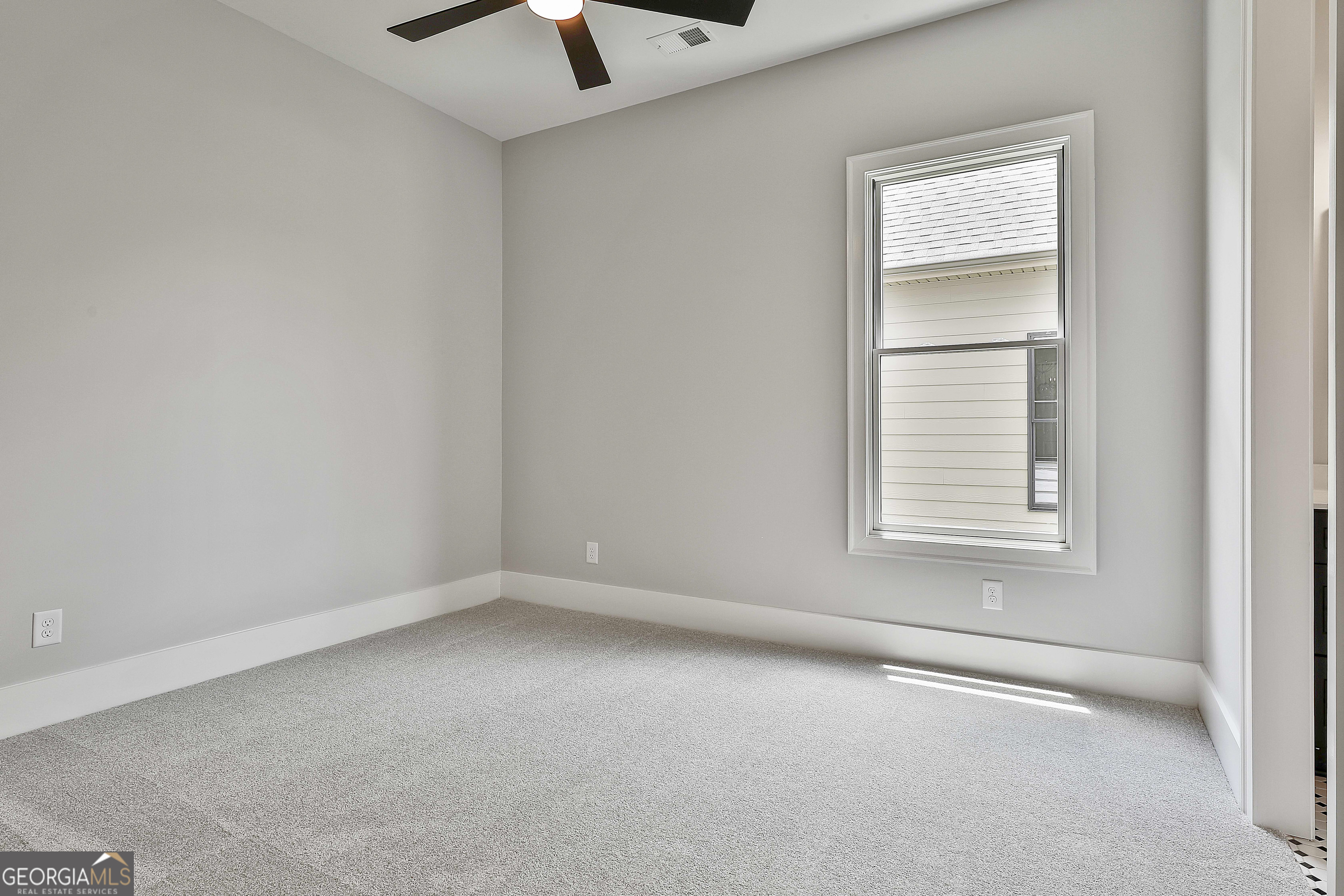 319 Ruffian Circle, Unit 71 Peachtree City, GA 30269 - Photo 28 of 43 an empty room with a window