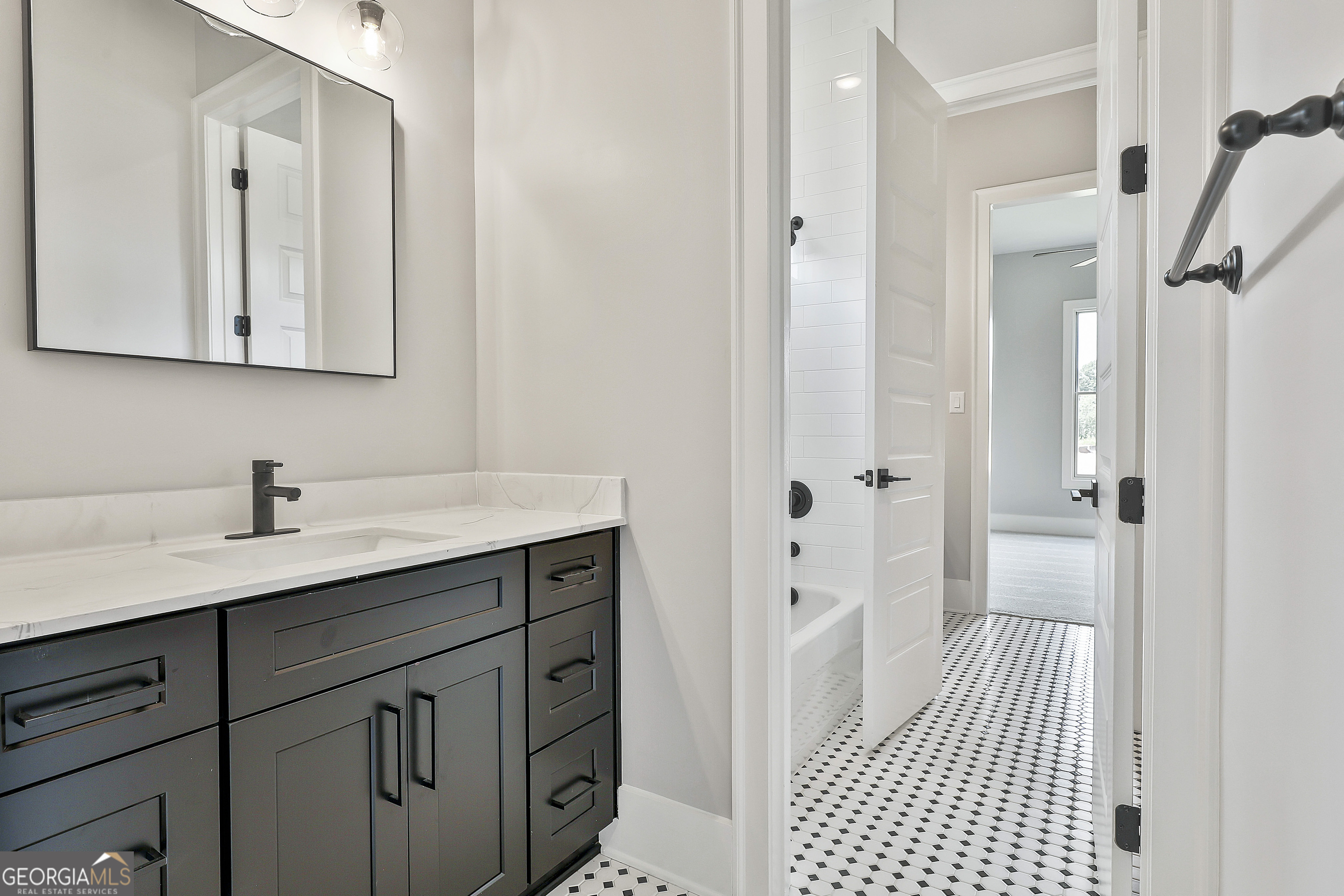 319 Ruffian Circle, Unit 71 Peachtree City, GA 30269 - Photo 29 of 43 a bathroom with a sink and a mirror