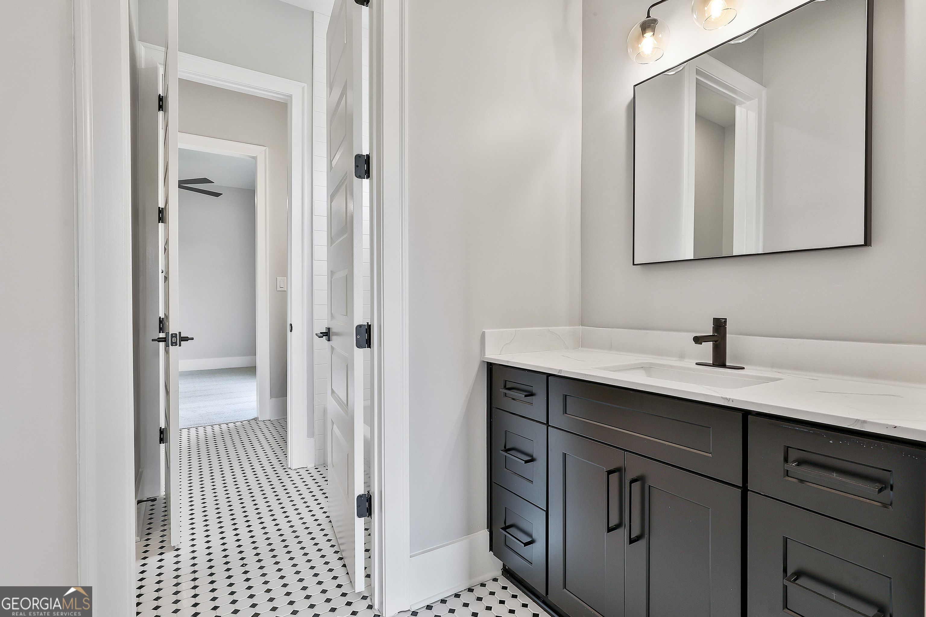 319 Ruffian Circle, Unit 71 Peachtree City, GA 30269 - Photo 33 of 43 a bathroom with a sink and a mirror