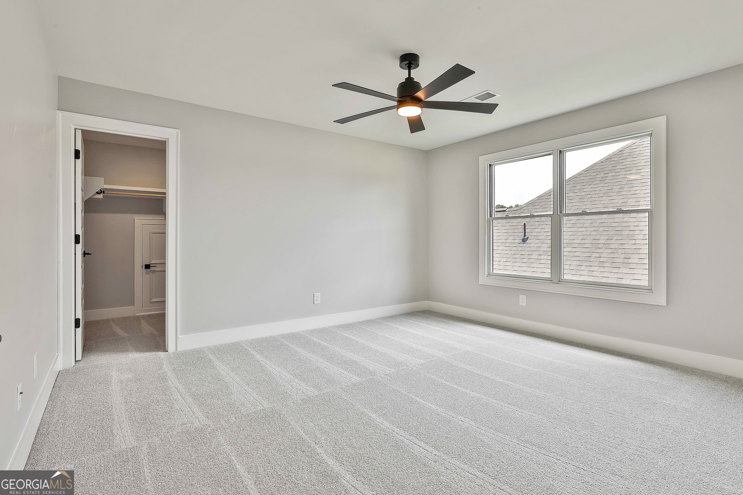 319 Ruffian Circle, Unit 71 Peachtree City, GA 30269 - Photo 35 of 43 wooden floor in an empty room with a window