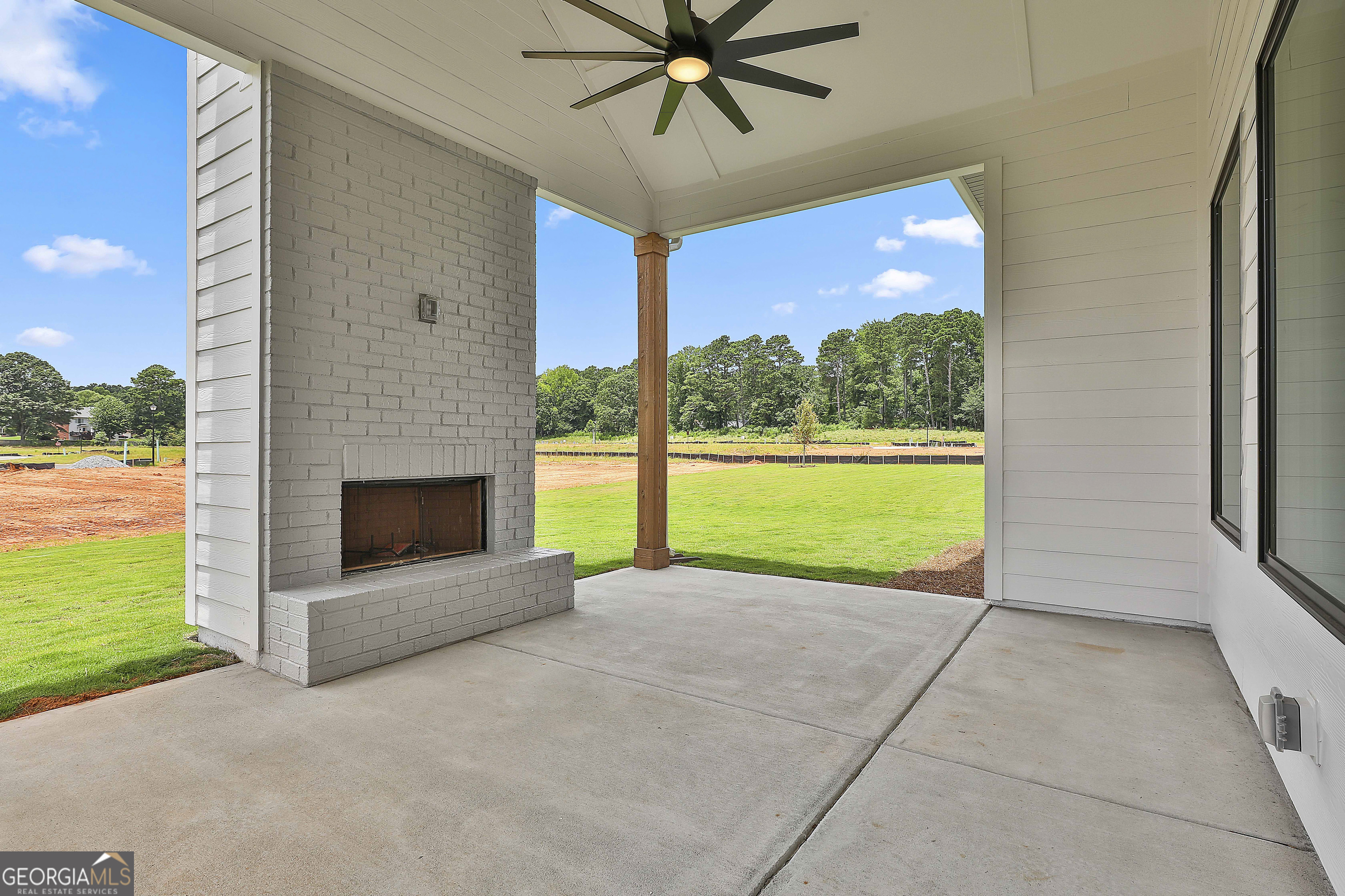 319 Ruffian Circle, Unit 71 Peachtree City, GA 30269 - Photo 40 of 43 a view of an empty room with a fireplace and a window