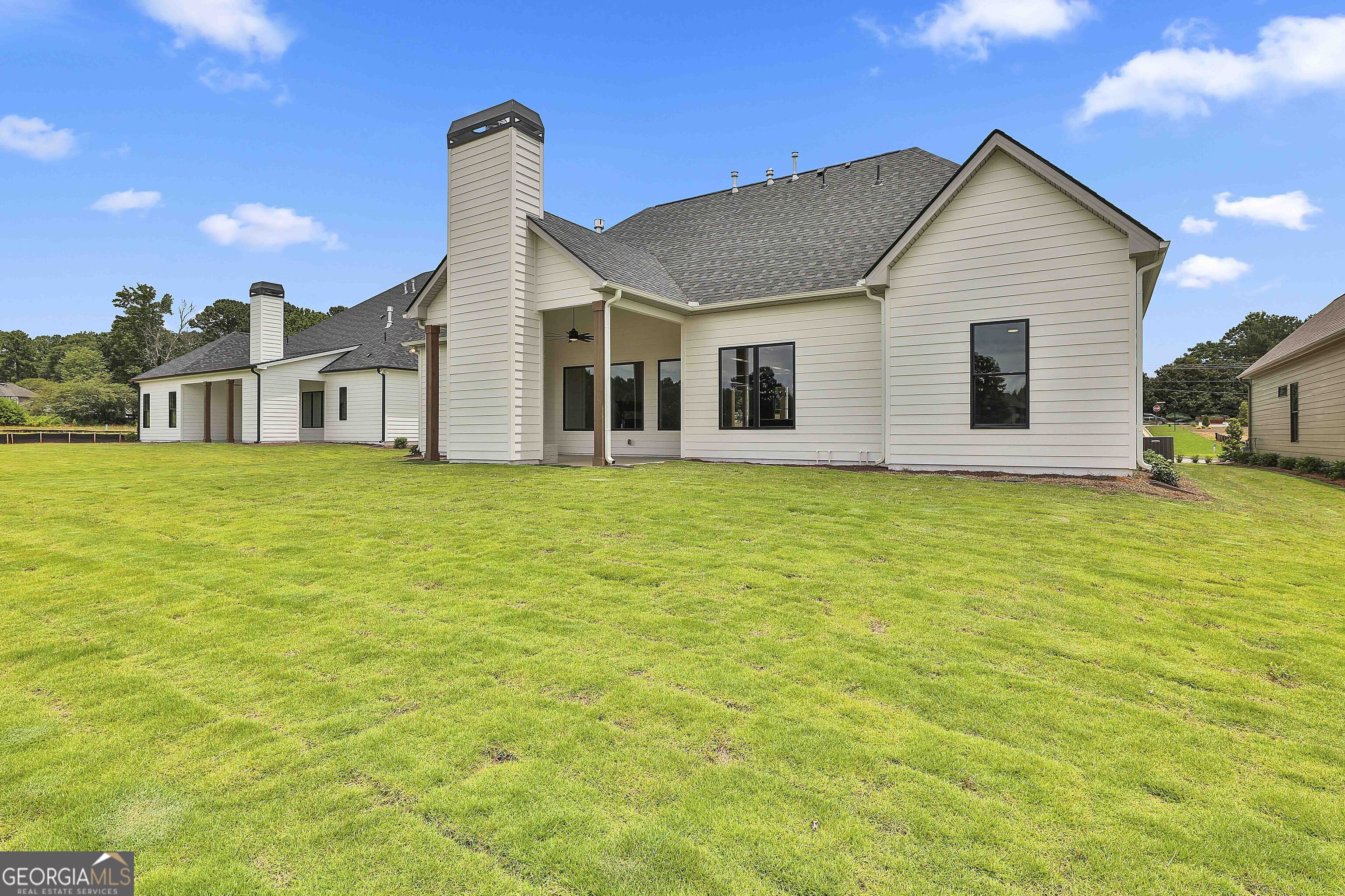 319 Ruffian Circle, Unit 71 Peachtree City, GA 30269 - Photo 42 of 43 a front view of a house with a garden