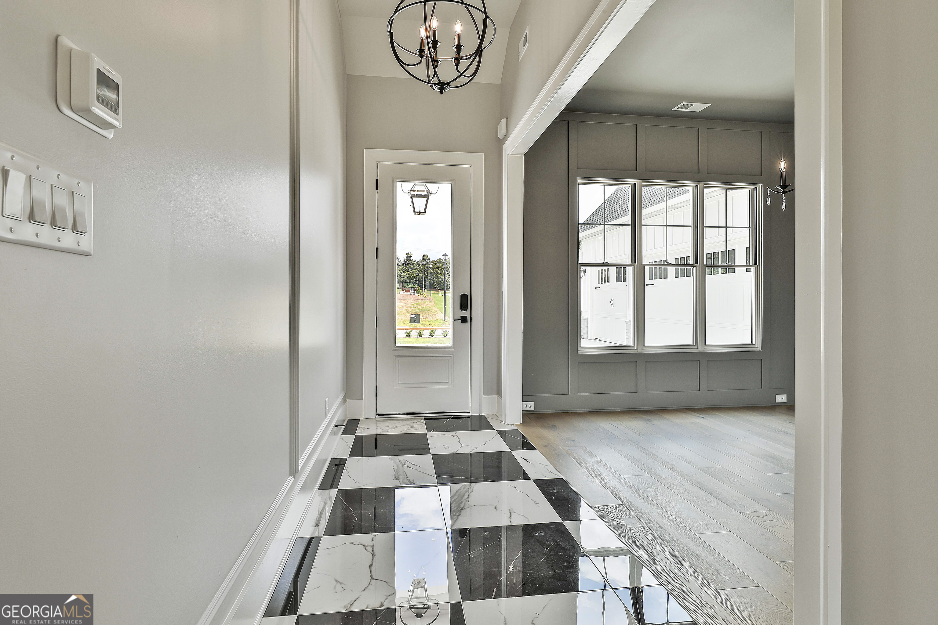 319 Ruffian Circle, Unit 71 Peachtree City, GA 30269 - Photo 7 of 43 a view of a hallway with front door