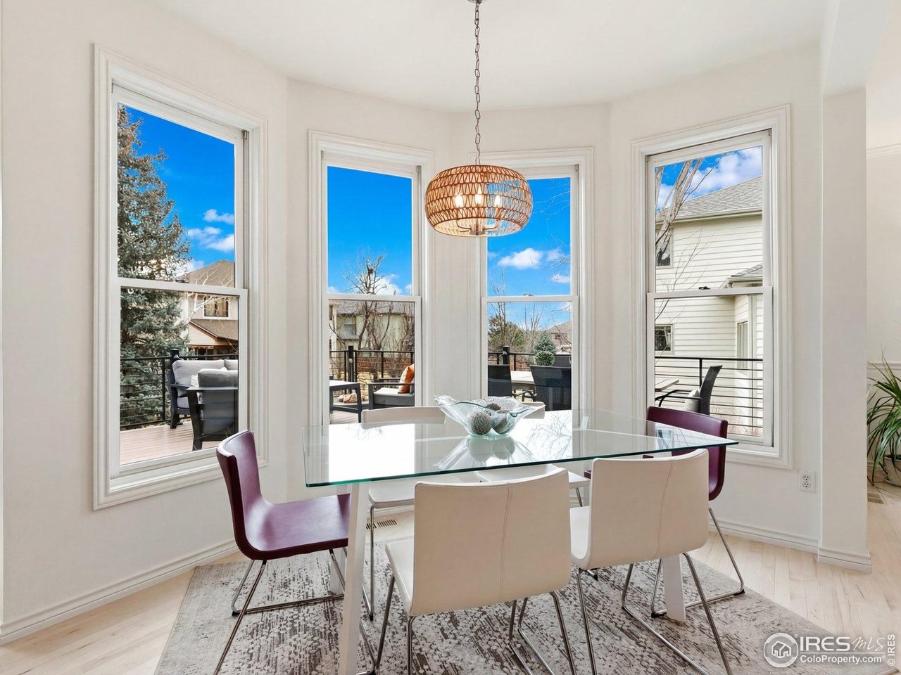 4796 6th Street Boulder, CO 80304 - Photo 16 of 47 a dining room with furniture a chandelier and wooden floor