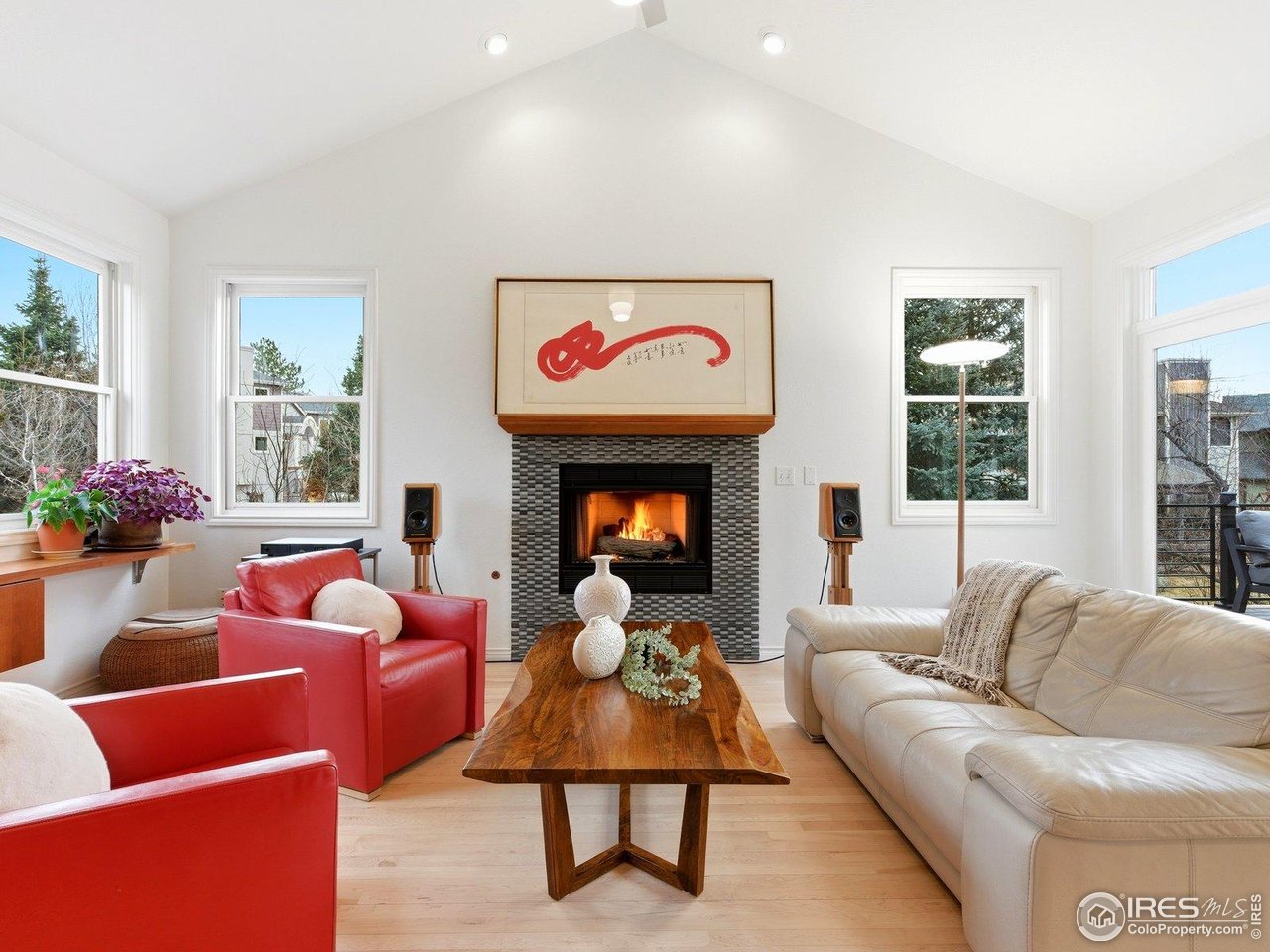4796 6th Street Boulder, CO 80304 - Photo 20 of 47 a living room with furniture a rug and a fireplace