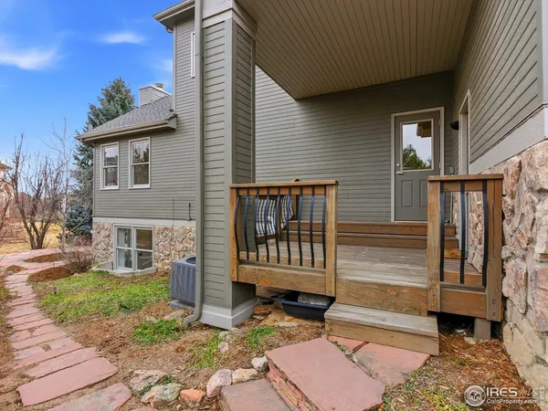 a living room with furniture and white walls