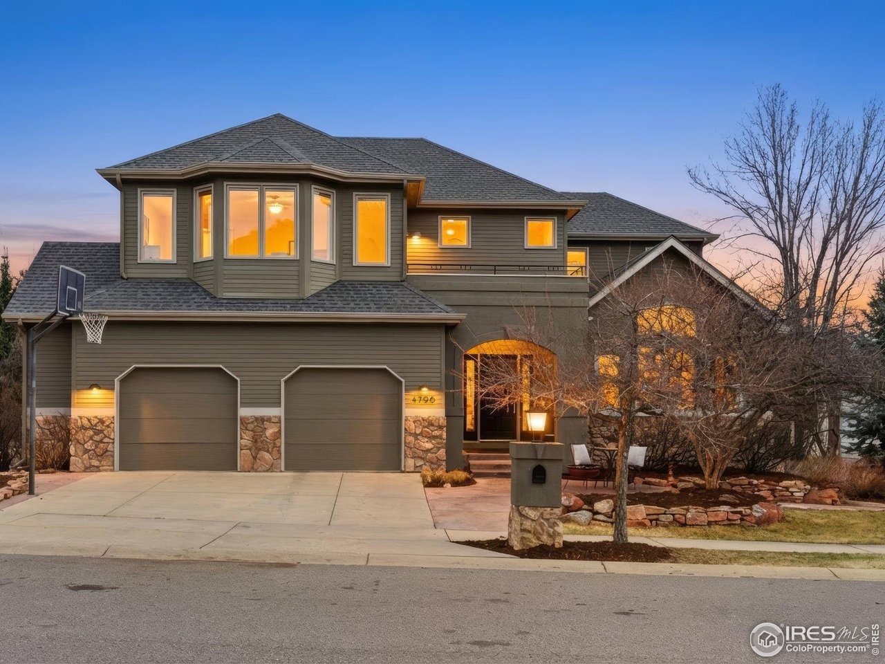 4796 6th Street Boulder, CO 80304 - Photo 4 of 47 a front view of a house with a yard