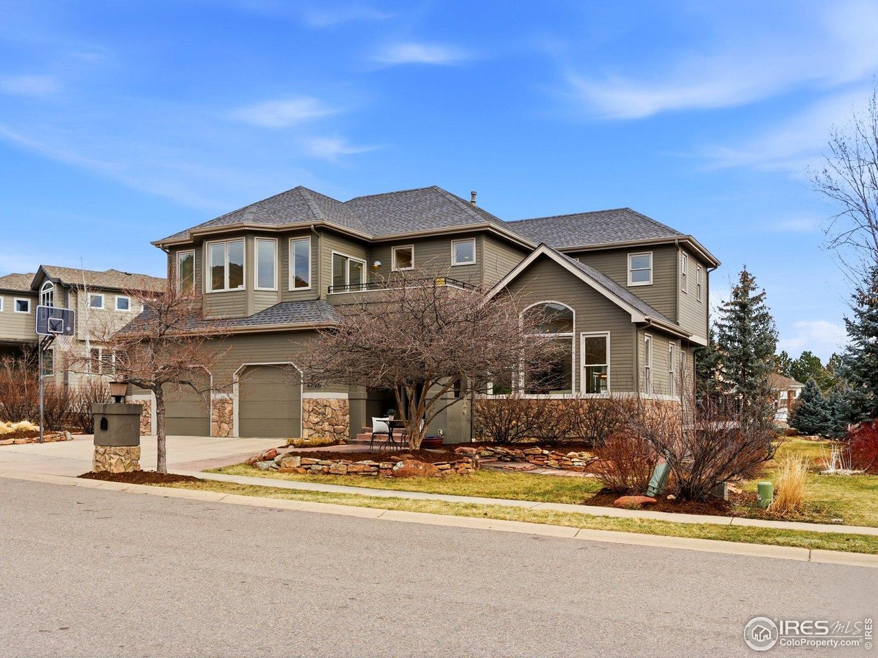 4796 6th Street Boulder, CO 80304 - Photo 5 of 47 a front view of a house with a yard