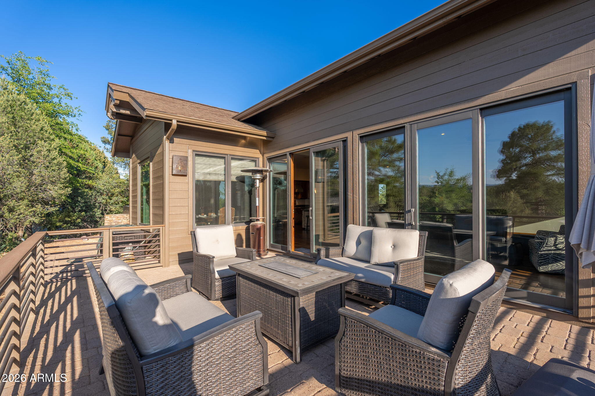 2208 East Filaree Circle Payson, AZ 85541 - Photo 34 of 60 a view of a patio with couches table and chairs and potted plants