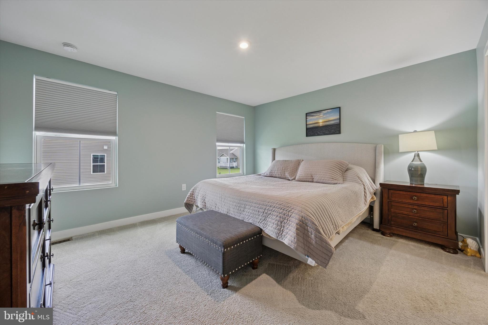 7 Senators Way Berlin, NJ 08009 - Photo 12 of 25 a spacious bedroom with a bed and a couch