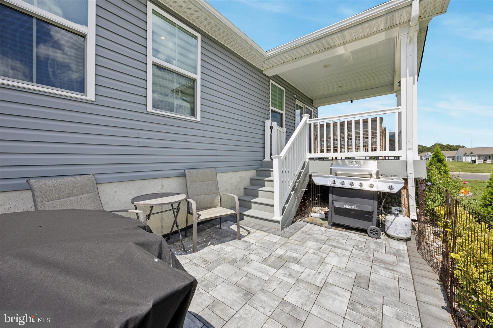 7 Senators Way Berlin, NJ 08009 - Photo 24 of 25 a roof deck with a bench and a barbeque