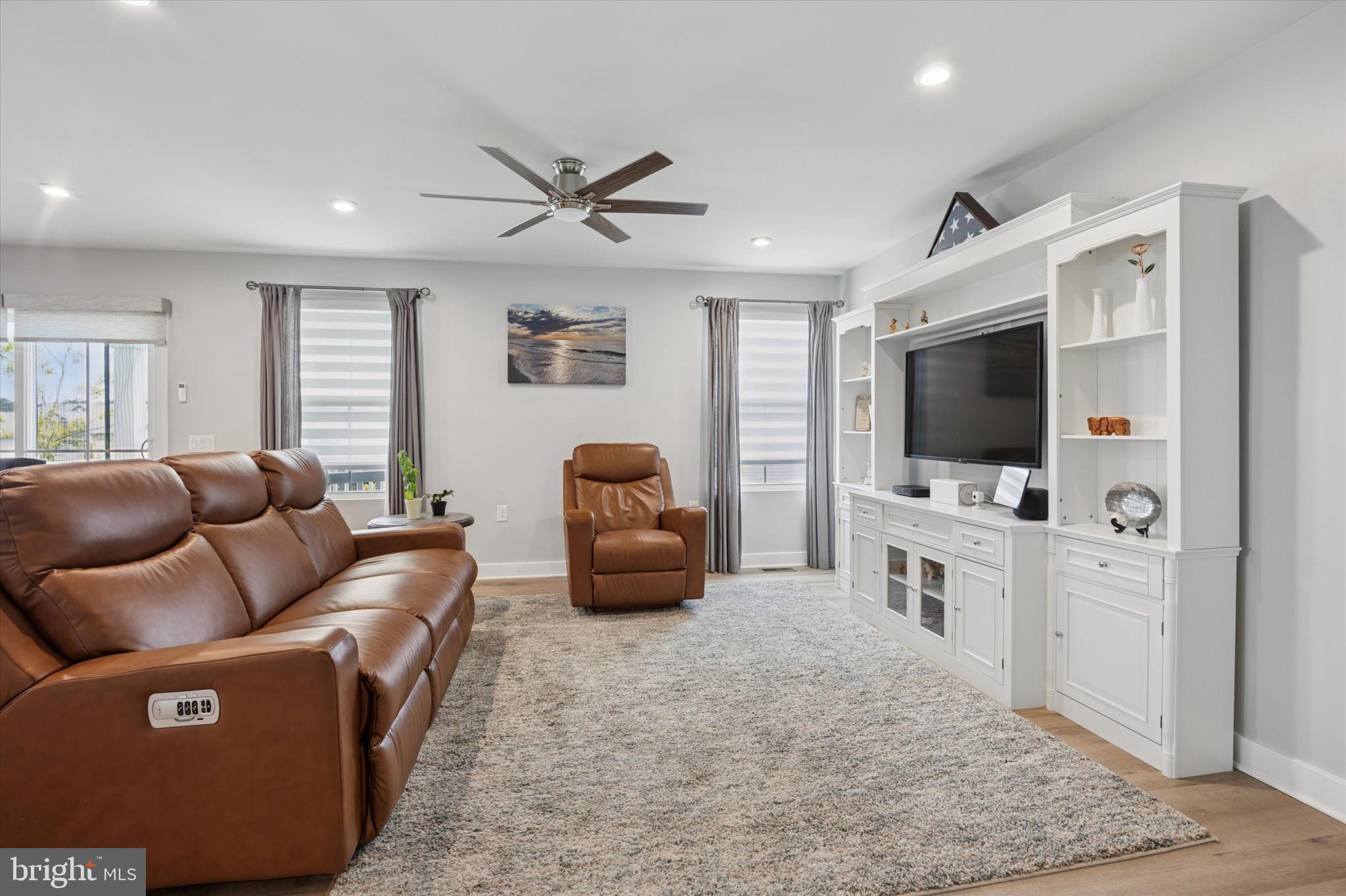 7 Senators Way Berlin, NJ 08009 - Photo 5 of 25 a living room with furniture and a flat screen tv
