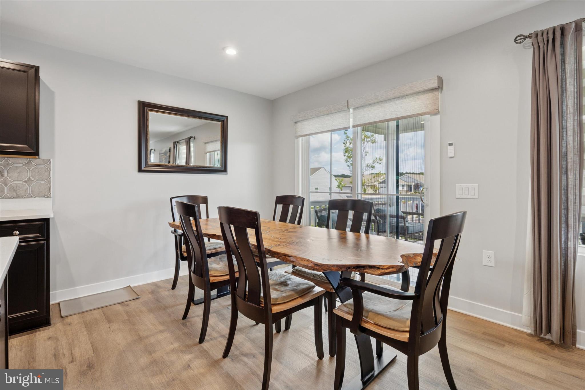 7 Senators Way Berlin, NJ 08009 - Photo 9 of 25 a view of a dining room with furniture window and wooden floor