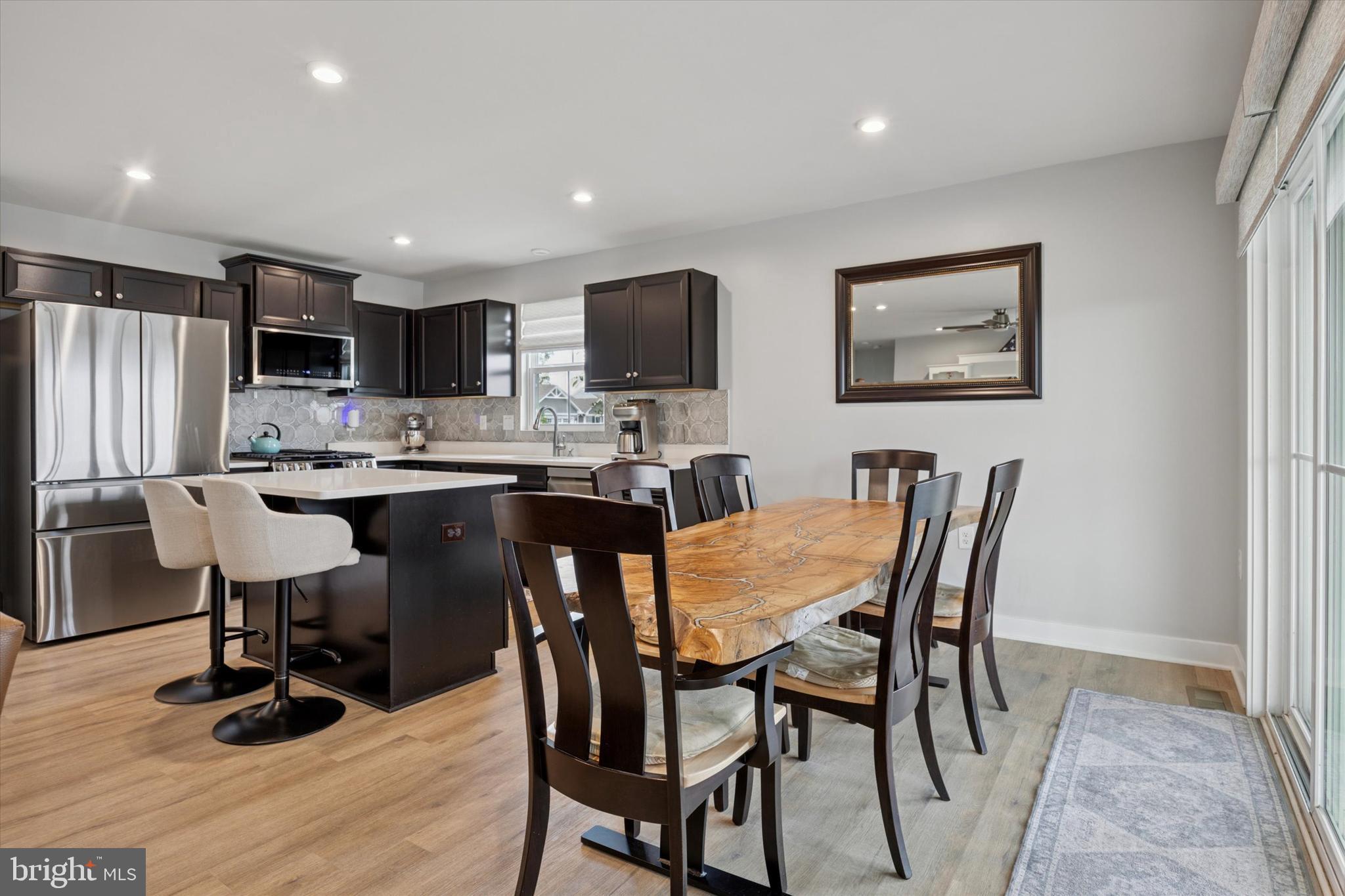 7 Senators Way Berlin, NJ 08009 - Photo 10 of 25 a view of kitchen with refrigerator dining table and chairs