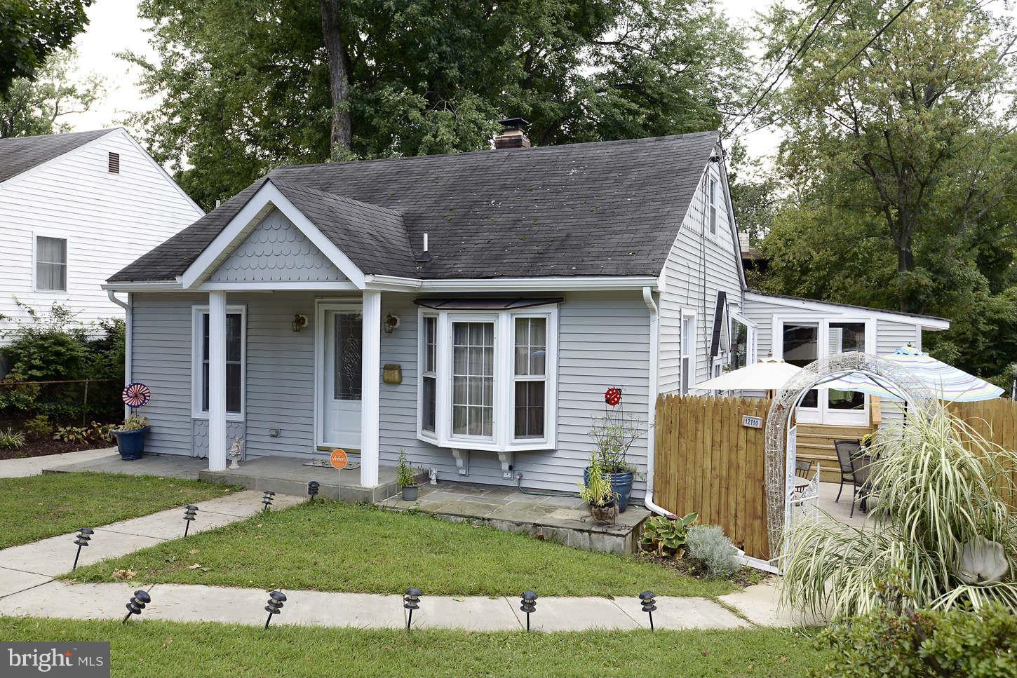 12110 Selfridge Road Silver Spring, MD 20906 - Photo 2 of 26 a view of a house with a yard and sitting area