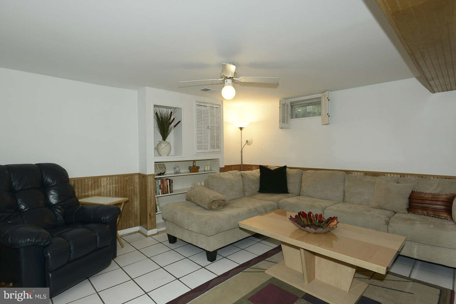12110 Selfridge Road Silver Spring, MD 20906 - Photo 24 of 26 a living room with furniture and a couch