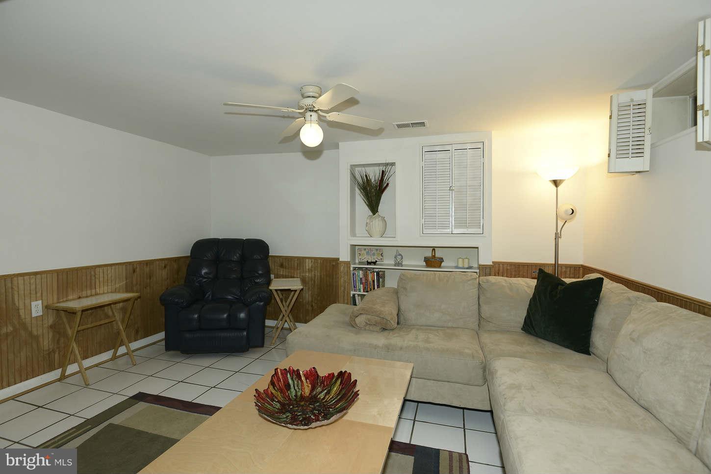12110 Selfridge Road Silver Spring, MD 20906 - Photo 25 of 26 a living room with furniture and a rug