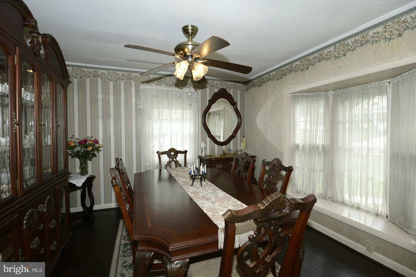 12110 Selfridge Road Silver Spring, MD 20906 - Photo 5 of 26 a view of a dining room with furniture and a large window