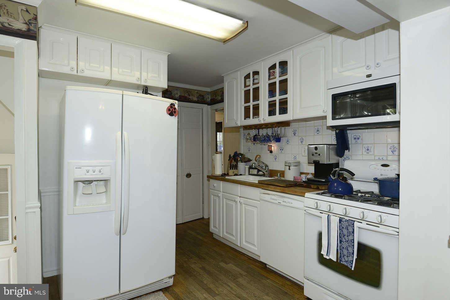 12110 Selfridge Road Silver Spring, MD 20906 - Photo 10 of 26 a kitchen with stainless steel appliances a refrigerator stove and sink