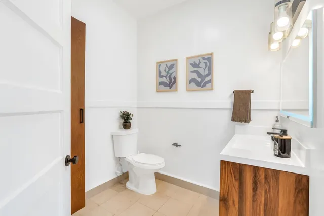a bathroom with a toilet and a sink