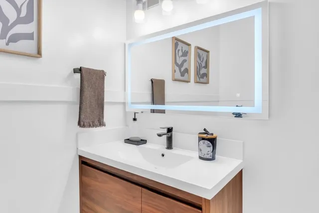 a bathroom with a sink and a mirror