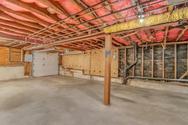 a view of a room with wooden walls