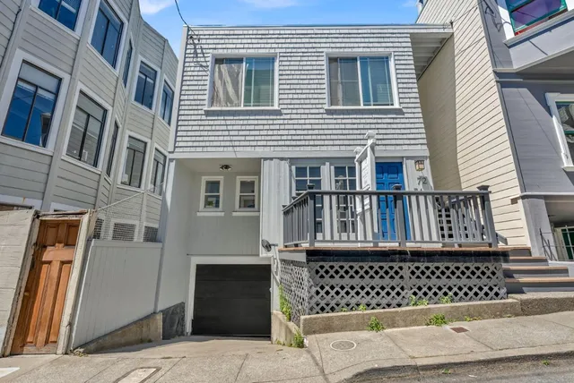 a view of a brick building with many windows