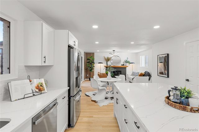 a bedroom with a large bed and a couch