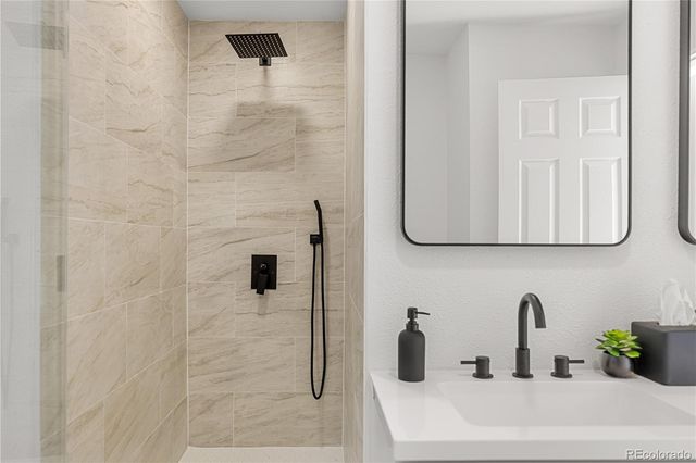 a living room with furniture and view of kitchen