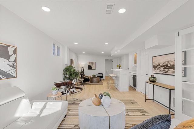 a view of a yard with plants and trees