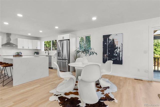a living room with furniture potted plant and a fireplace