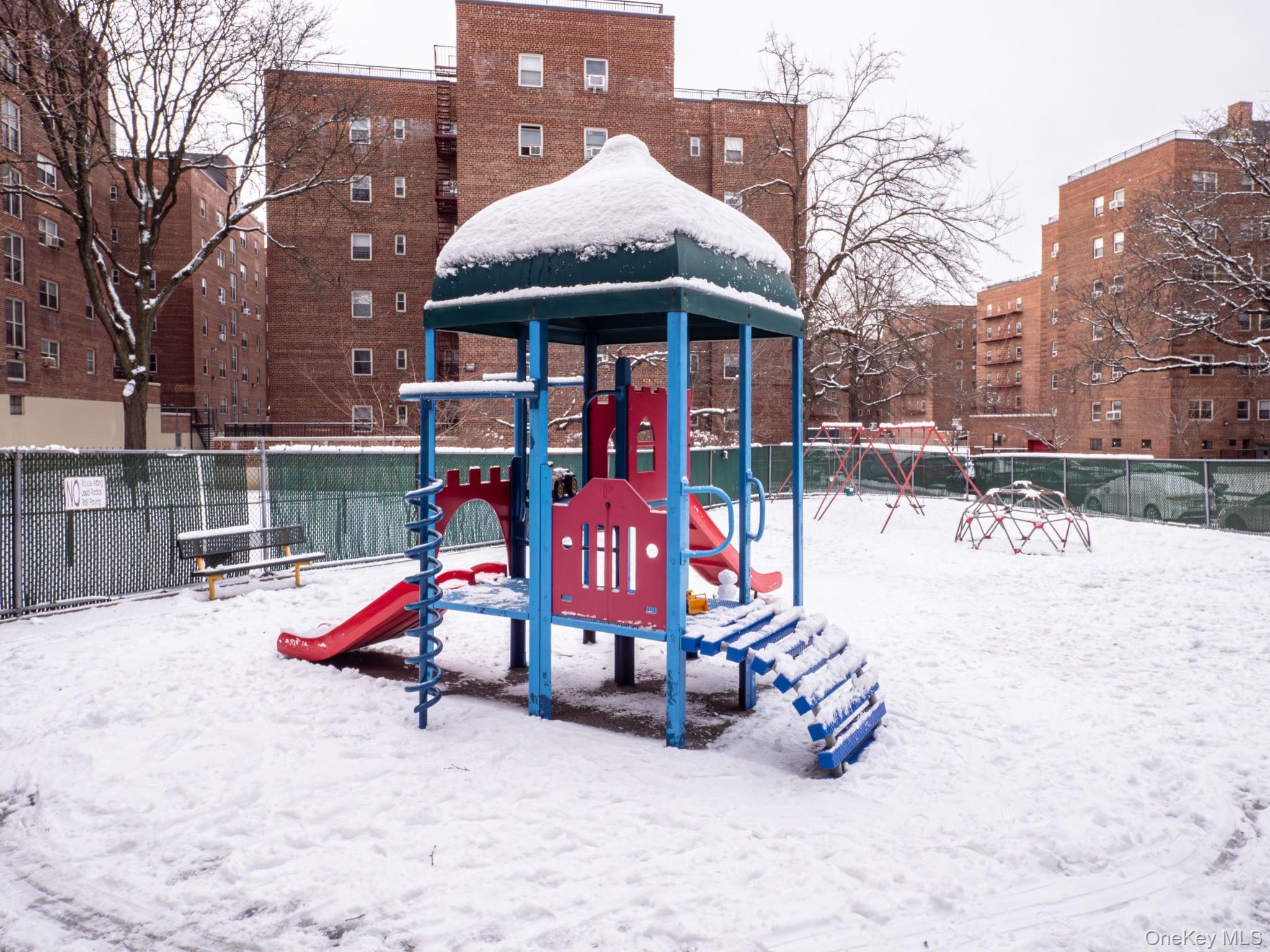 139-15 83rd Avenue, Unit 423 Queens, NY 11435 - Photo 23 of 24 View of snow covered playground