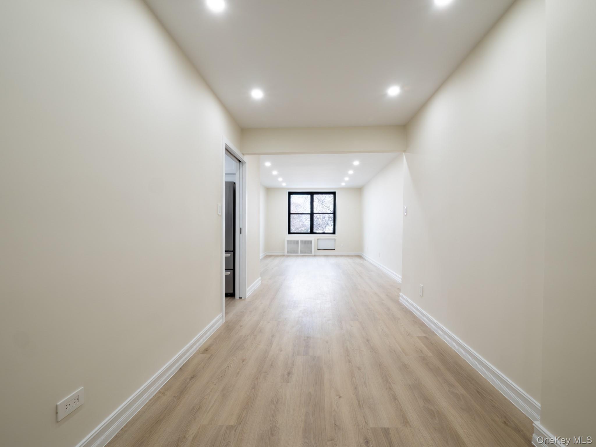 139-15 83rd Avenue, Unit 423 Queens, NY 11435 - Photo 3 of 24 Hall featuring light wood-style floors and recessed lighting