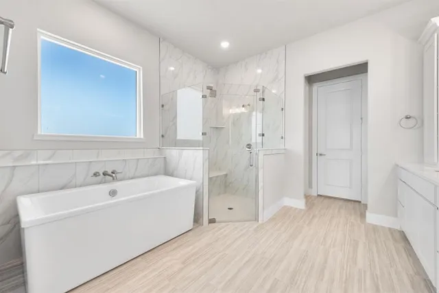 a spacious bathroom with a double vanity sink and mirror