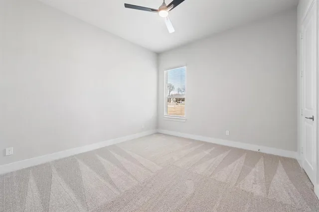 a bathroom with a toilet a sink a bathtub and a mirror