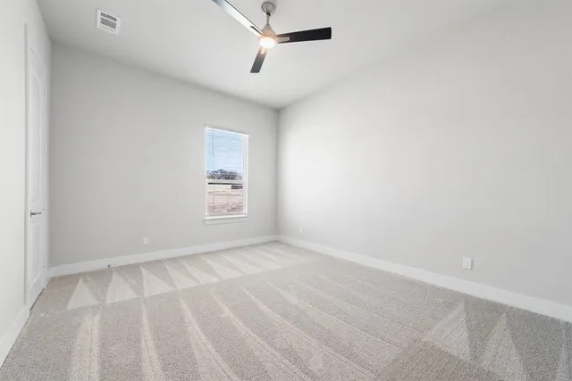 a living room with furniture a flat screen tv and a table