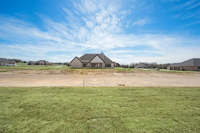 a view of a house with a big yard