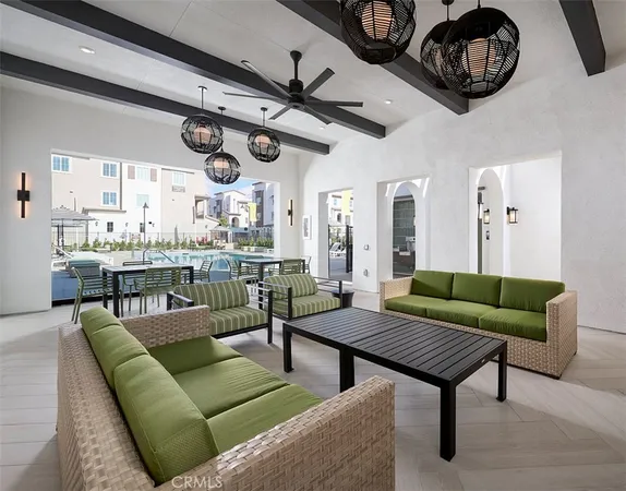 a living room with lots of furniture and a clock
